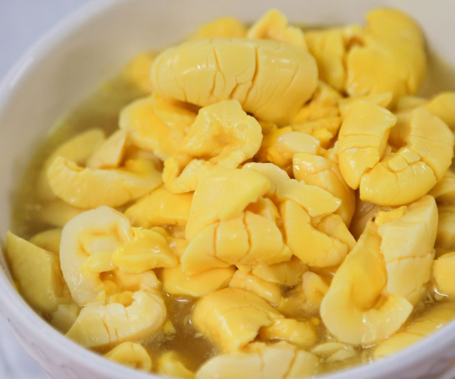 Proceso de preparación de Ackee con pescado salado